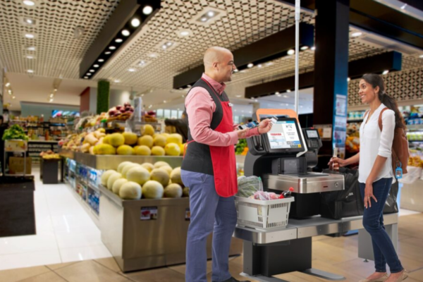 Self-checkout grocery Woman using self-checkout lane in grocery store